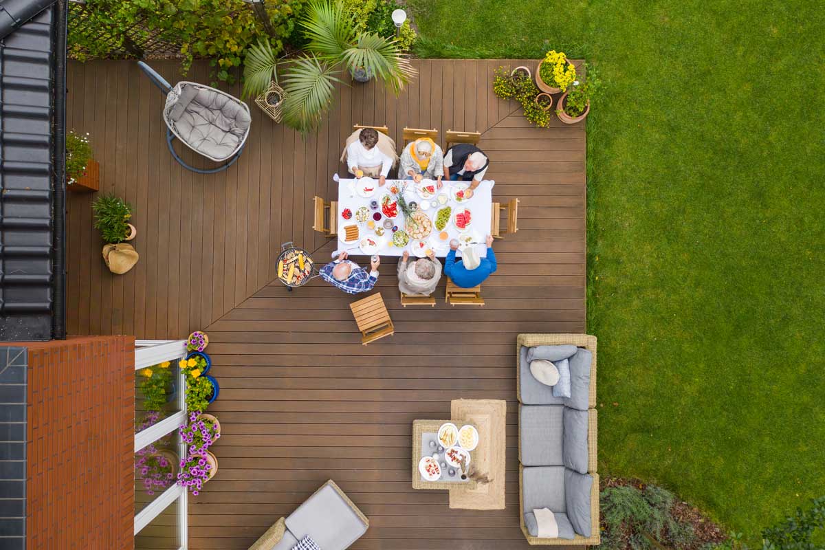 Aerial view of people enjoying lunch on the patio deck.