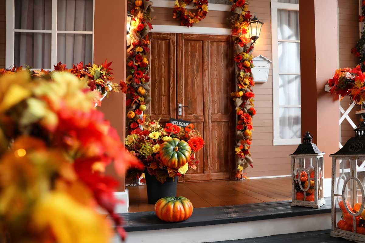 Fall Porch Decorated With Pumpkins And Colorful accents